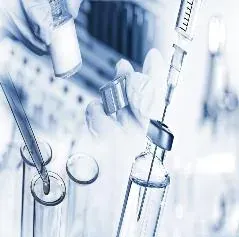Blue-toned collage of a gloved hand filling a syringe from a vial, with test tubes, a dropper and glass vials