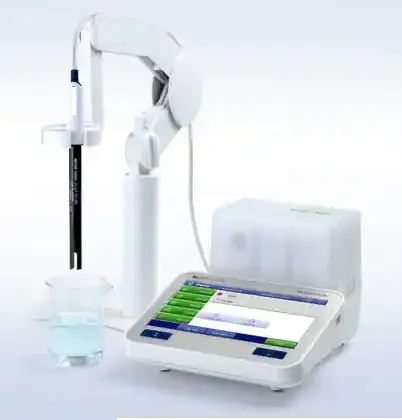 Benchtop conductivity meter with a touchscreen display and a probe on a swing arm held over a beaker of liquid